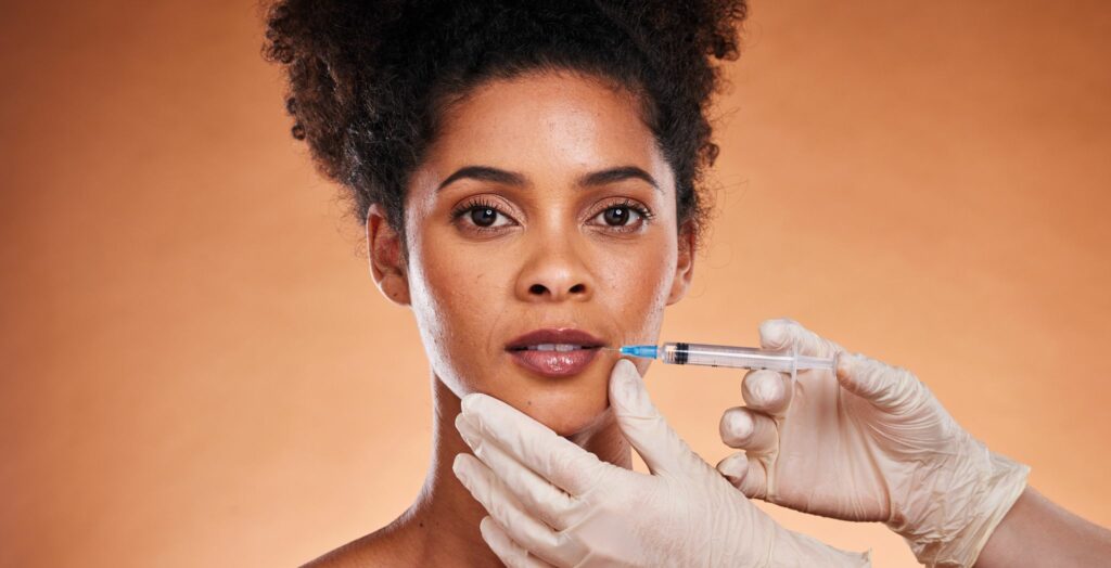 Botox injection procedure at clinic, Dermal fillers applied to enhance facial volume, Before and after Botox or dermal filler treatment, Close-up of facial rejuvenation with dermal fillers, Cosmetic treatment with Botox for wrinkle reduction, Patient receiving Botox or dermal filler injections, Minimally invasive anti-aging facial treatment, Smooth skin after Botox or dermal filler application, Clinician performing dermal filler procedure, Natural-looking results from Botox and fillers,